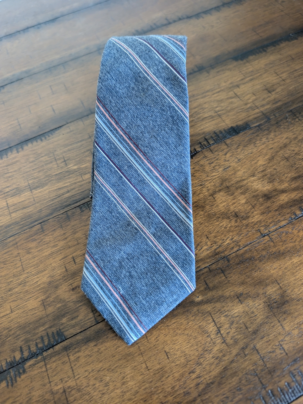 Men's Blue Diagonal Stripe Tie with Subtle Red and White Accents